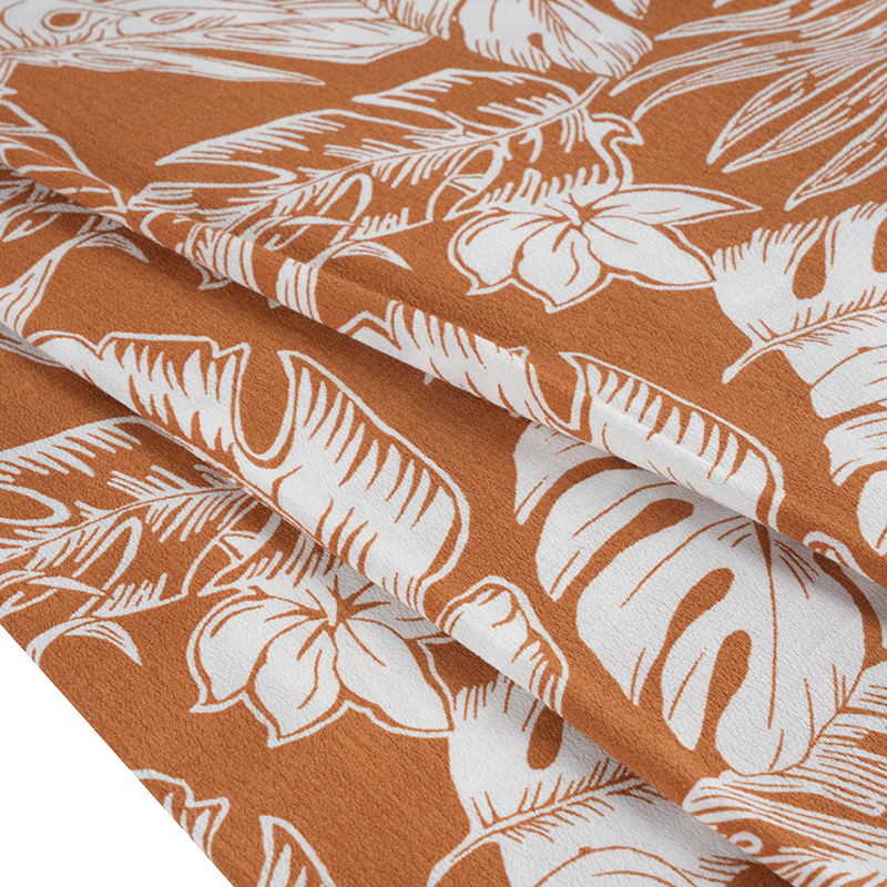 Bohato tkaná krepová tkanina s potlačou